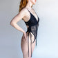 Black lace bodysuit with adjustable side ties and lightly lined cups