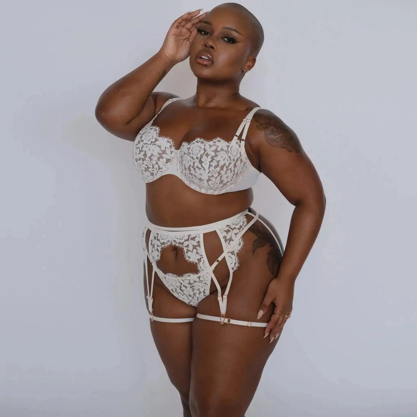 White lace, underwire, high support bra with adjustable straps and back closure with matching lace garter and panty