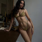 Green lace and satin triangle cup bralette with matching thong and garter belt