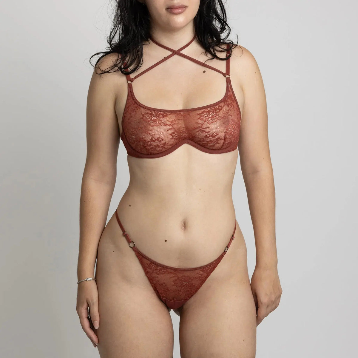 Brown stretch lace bikini with cutout design in back and adjustable side strap and matching wired bralette with back closure