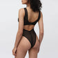 Black opaque on sheer striped microfiber bodysuit with back and front cutouts, snap closure at gusset and back clasp