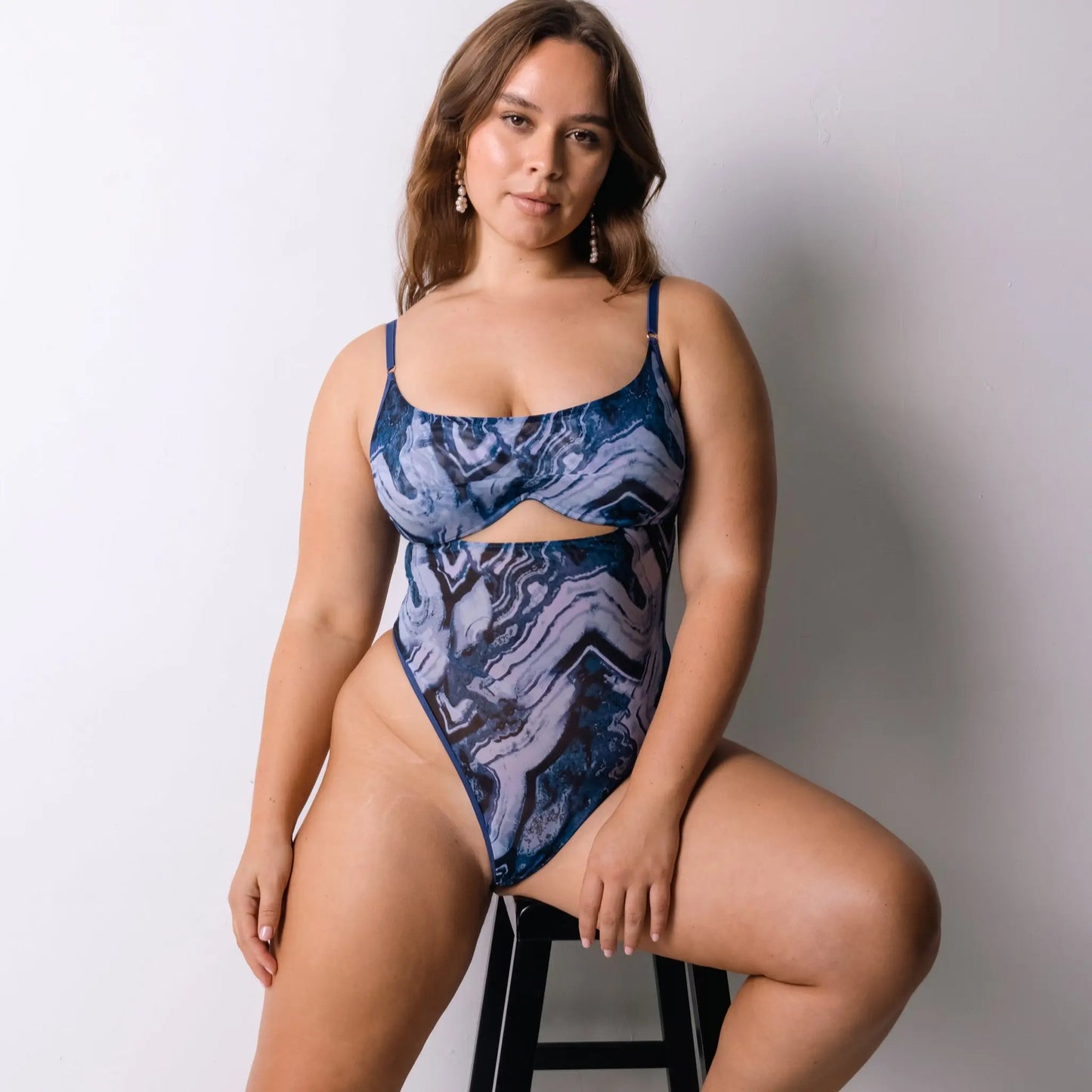 Blue abstract print mesh bodysuit with underwire and back closure, thong back coverage and button snap closure in gusset