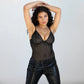Black opaque on sheer striped microfiber bodysuit with flexible underwire, adjustable straps and back closure with button snap close at gusset