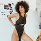 Black opaque on sheer striped microfiber bodysuit with back and front cutouts, snap closure at gusset and back clasp