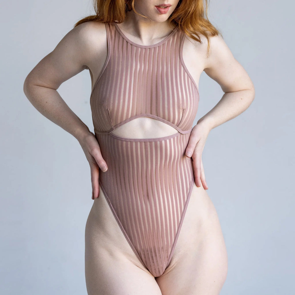 Taupe opaque on sheer striped microfiber bodysuit with back and front cutouts, snap closure at gusset and back clasp