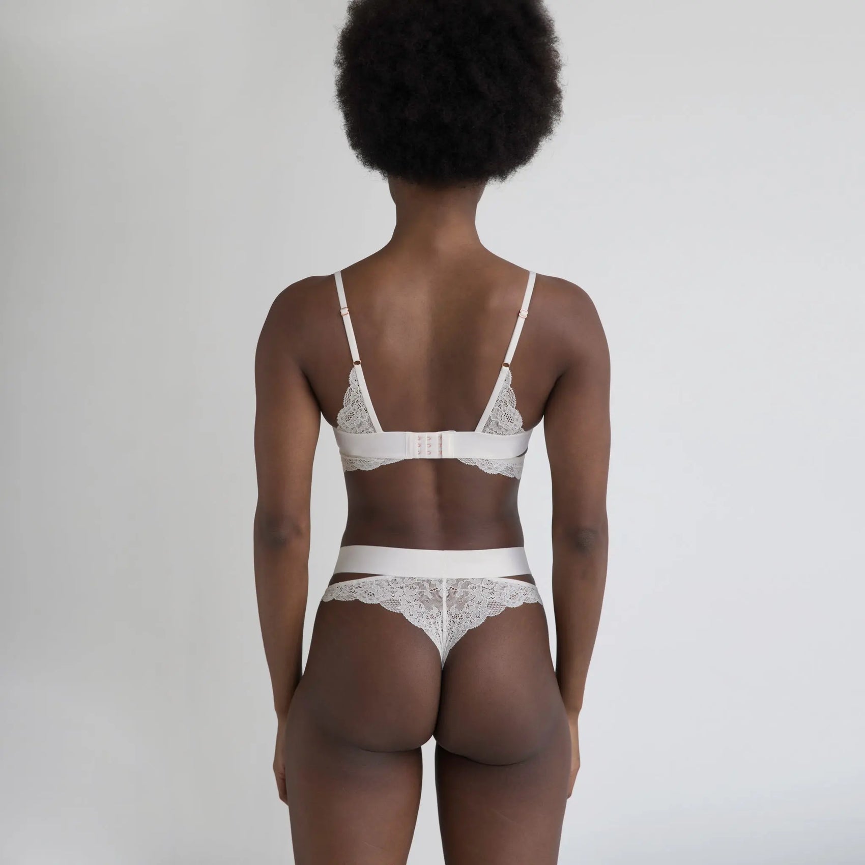 White stretch lace cheeky panty with side cut-outs and wide elastic bands