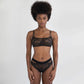 Black stretch lace bralette with adjustable straps, pull-over style